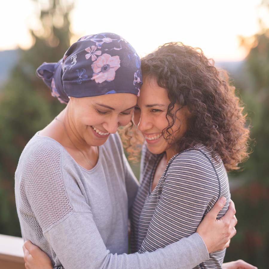 a cancer patient hugging her daughter
